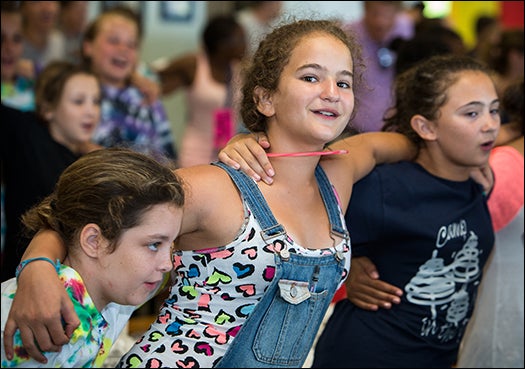 Campers join in song during the last day of camp at Camp Needles in the Pines.