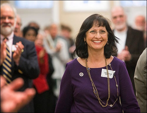 ECU Honors College Dean Marianna Walker comes forward to receive an award during the reception.