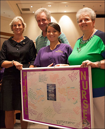 First year nursing student Anna Zeng, who underwent brain surgery for a tumor this summer, was back in time to enjoy the Lamp of Learning ceremony. With her are ECU College of Nursing Dean Dr. Sylvia Brown, far left, and Zeng's grandparents, Paul and Sharon Lombardi.