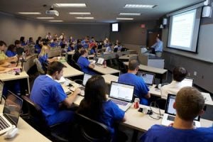 Dr. Todd Watkins speaks during a class at the ECU School of Dental Medicine. Students and faculty use the social networking tool Yammer to facilitate discussions during and after class. Photo by Cliff Hollis