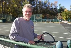 John Anema enjoys tennis almost daily at Baywood Racquet Club. Photo by Cliff Hollis, ECU News Services.