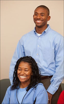 James Collins stands behind his mother, Lynette.