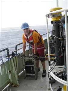 Graduate student Ben McGlaughon prepares to deploy a laser optical plankton counter last summer on the Gulf of Mexico. (Contributed photo)