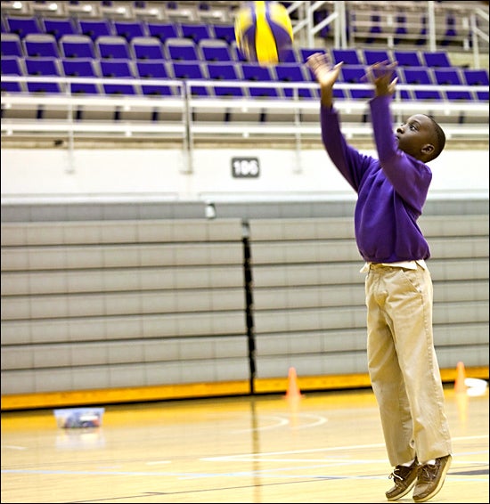 Pitt County student Tolbert Wangila shoots baskets at East Carolina University. Wangila is participating in ECU's adapted physical education program, which helps ECU students learn how to meet the physical education needs of children with disabilities. (Contributed photos by Chuck Baldwin)