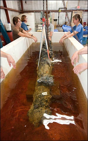 The cannon from Blackbeard's ship, the Queen Anne's Revenge, rests in a holding tank at the QAR Conservation Lab at ECU.