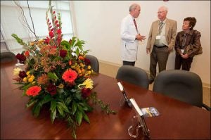 Dr. Kenneth Steinweg, chair of family medicine at ECU, talks with Dr. Robert Jones and his wife, Mabel. Photo by Cliff Hollis