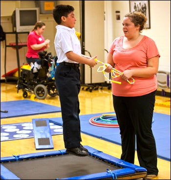 ECU student Hayley Goff of Walstonburg works with Gabriel Flores in the adapted education program.