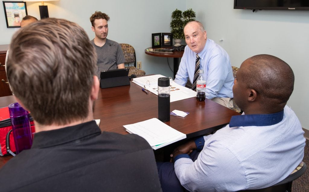 ECU Brody School of Medicine professor Dr. Robert Carroll leads a group discussion.