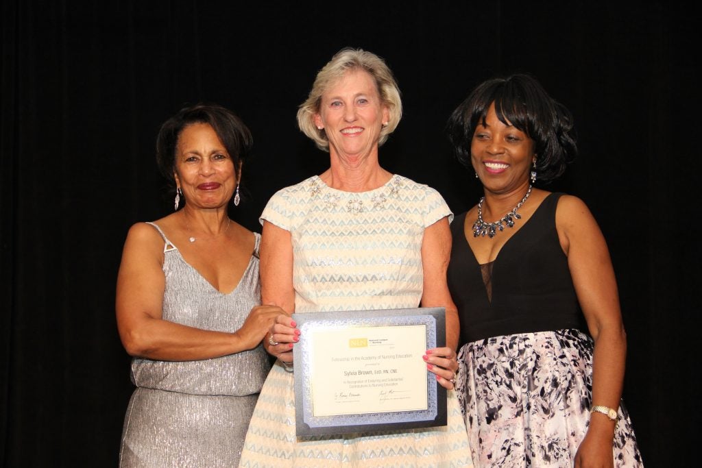 Dr. Sylvia Brown, center, was recently inducted as a Fellow in the Academy of Nursing Education.