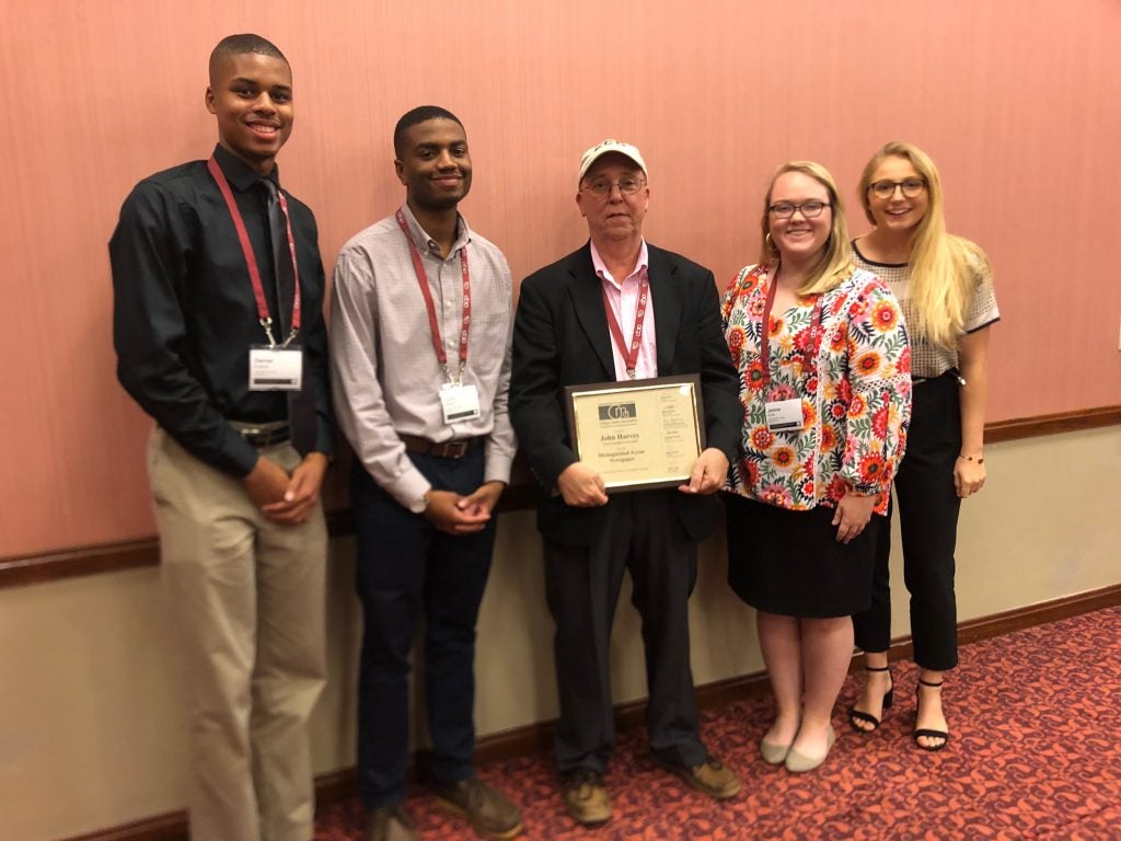 Student Media Director John Harvey (center) received one of the nation's top awards for collegiate media advisers last month at the College Media Association Convention, where he was joined, from left, by TEC students Daniel Roberts, Trajan Warren, Jenna Price and Darby Hubbell.