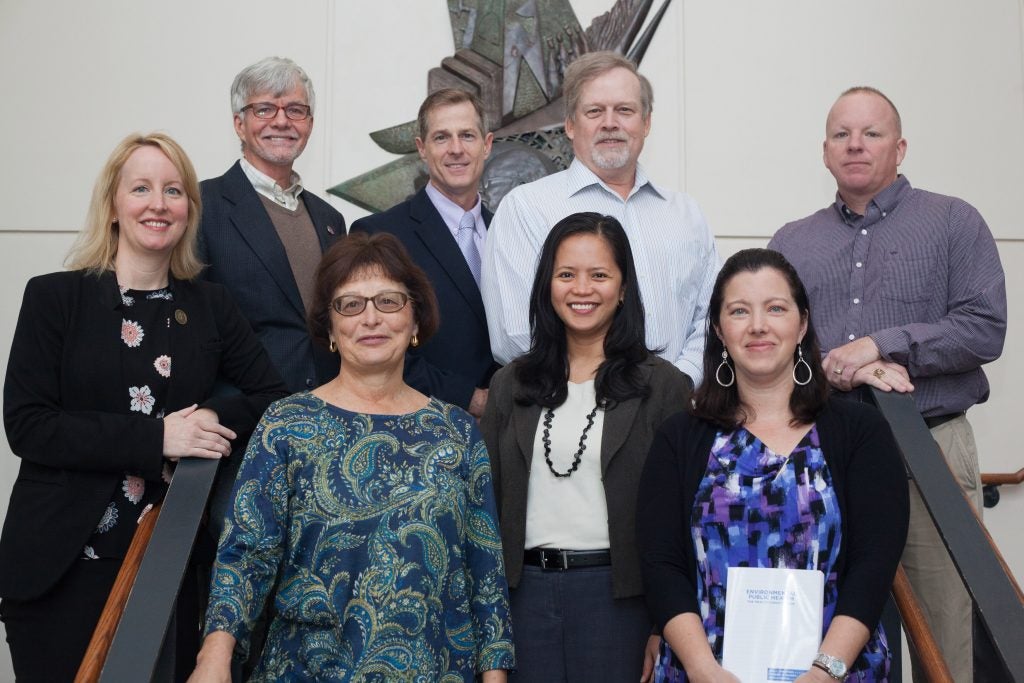 Faculty members from ECU who collaborated on a new environmental health book recently presented copies to Elizabeth “Beth” Ketterman, director of Laupus Library, (far left bottom row) and Janice Lewis, director of Joyner Library (next to Ketterman). The faculty are top row left to right, Dr. Tim Kelley, Dr. Greg Kearney, Dr. Paul Knechtges and Dr. Charlie Humphrey, and bottom row left to right, Ketterman and Lewis with Dr. Jo Anne Balanay and Dr. Stephanie Richards.