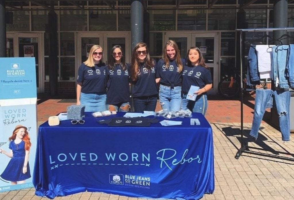 The National Retail Federation Student Association at ECU collects denim in front of Dowdy Student Stores on campus. 