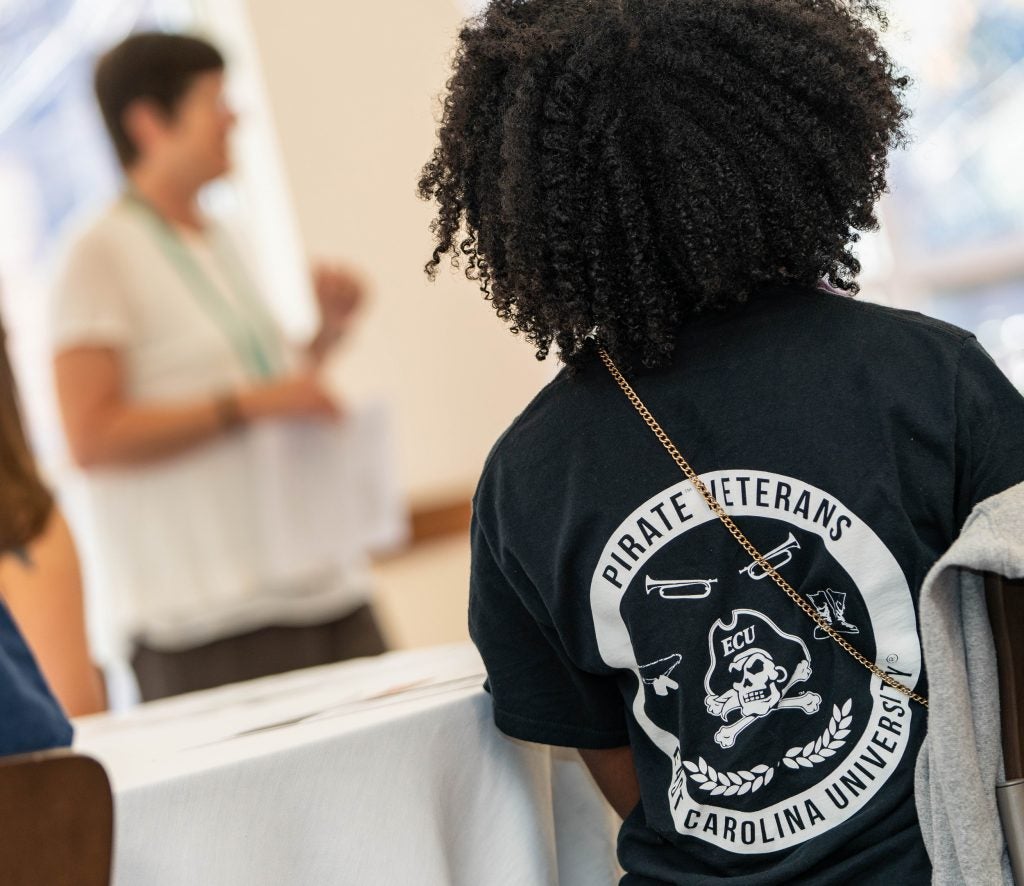 A Women’s Veterans Luncheon attendee listens to the guest speaker. 