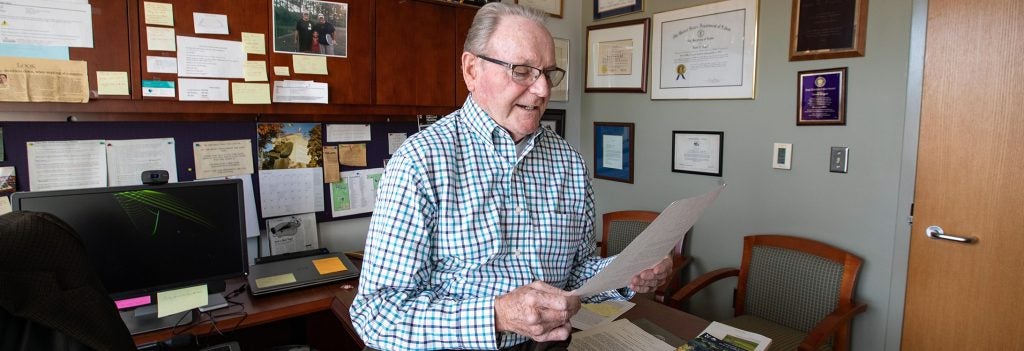 ECU Professor Dr. David Edgell, former senior executive director of U.S. Travel and Tourism Administration, reads from the prepared statement that he read on behalf of Vice President George H. W. Bush to attendees of the International Conference of Tourism in the 1990s. 