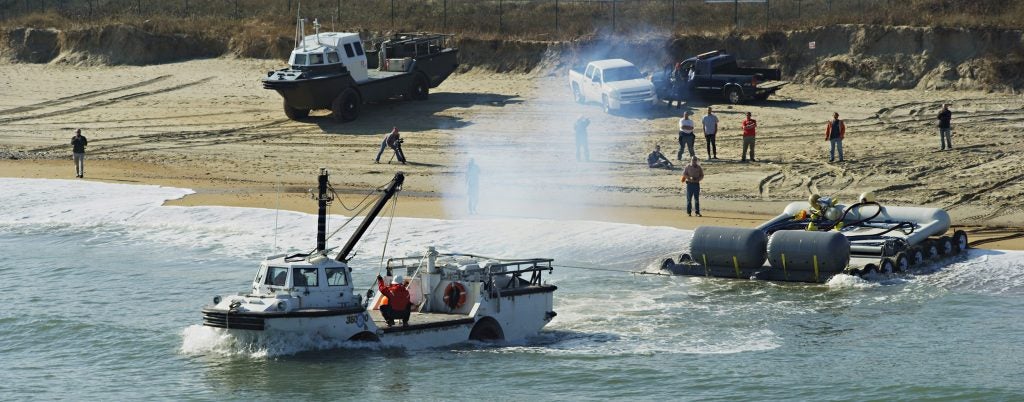 The North Carolina Renewable Ocean Energy Program works with private industry to test ocean energy devices. In this photo, a wave energy converter is being deployed in partnership with the U.S. Army Corps of Engineers Field Research Facility in Duck.