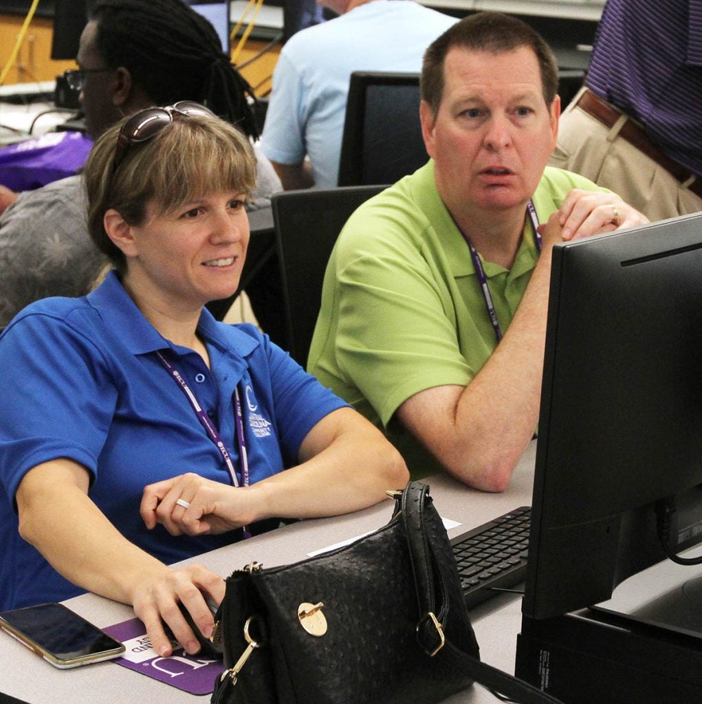 Constance Boahn, left, chair of the Engineering and Computer Information Technologies Department at Central Carolina Community College, works with Kelly Caudle, a program chief at Stanly Community College.