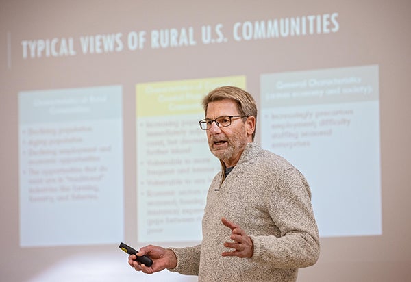 Assistant professor Jacob Hochard addresses the crowd at the third annual Coastal Conversations Conference.