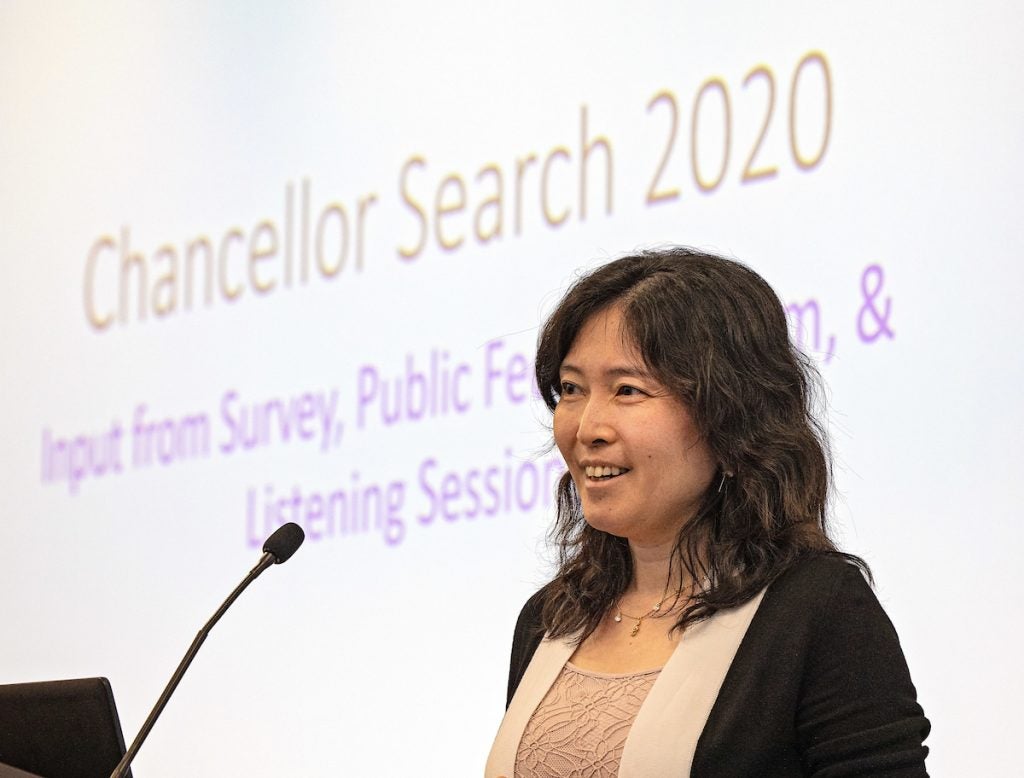 Ying Zhou, associate provost of institutional planning, assessment and research, presents survey results to the committee.