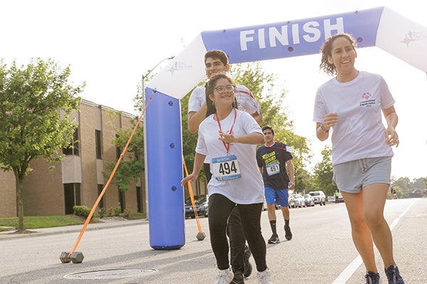 Peru and Special Olympics delegates run in the Fleet Feet Big Run 5K on Global Running Day