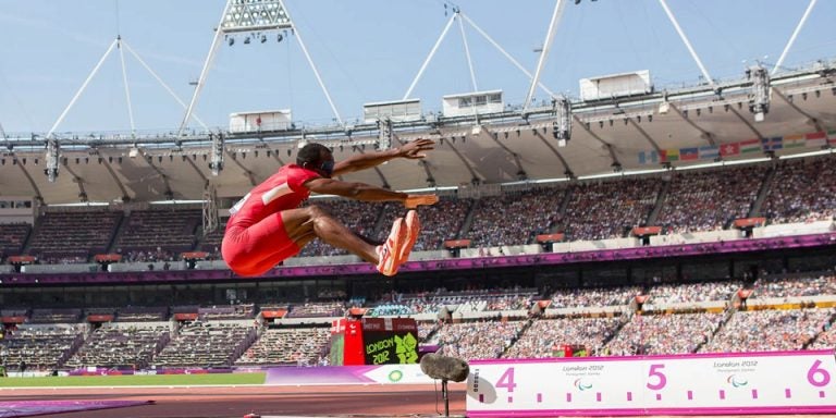 ECU alumnus Lex Gillette '07 competes in the long jump at the 2012 Paralympics in London. The 2016 games in Rio will be his fourth Paralympics. (Contributed photos)
