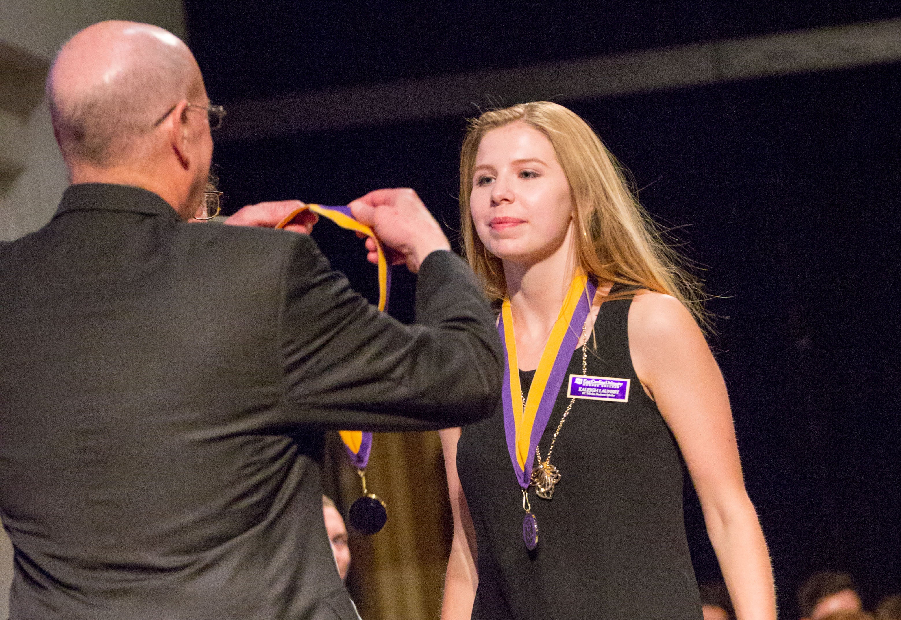 Kaleigh Launsby accepts her medallion at EC Scholars recognition ceremony. (Photo by Cole Dittmer)