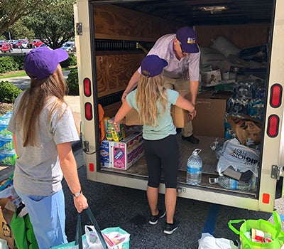 Brody-supplies: Students and faculty load a truck with supplies at ECU’s Brody School of Medicine. (Contributed photo)