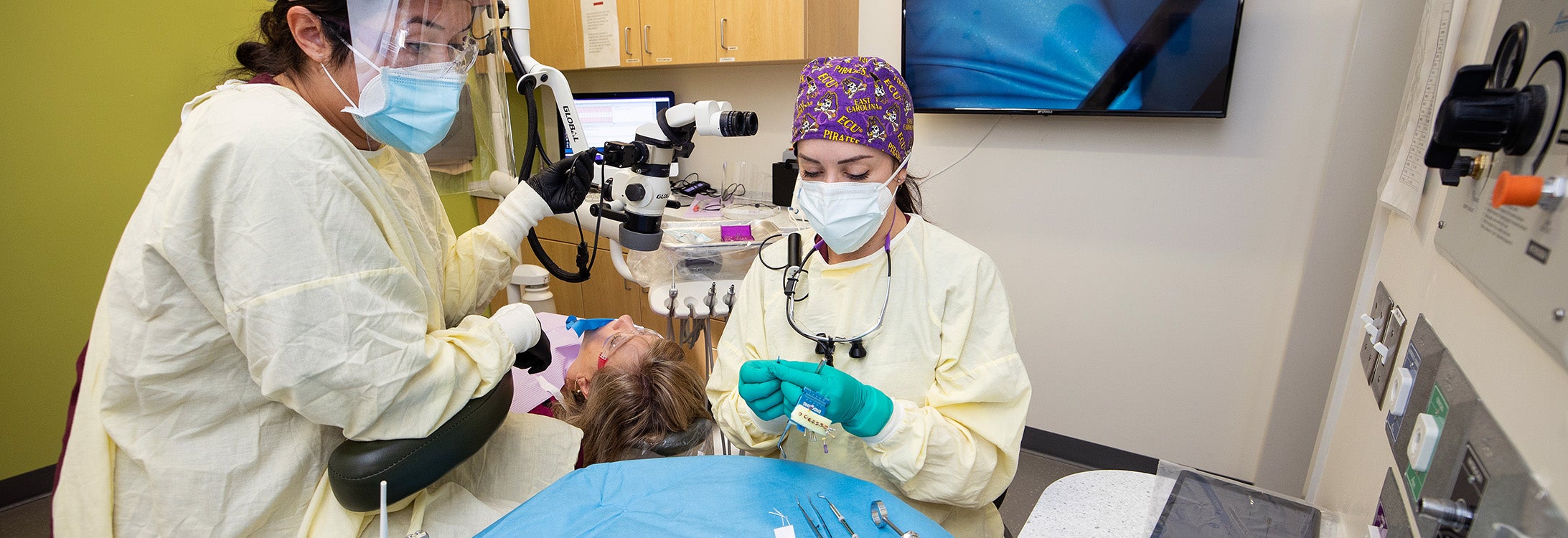 Fourth-year ECU School of Dental Medicine student Victoria Hardy prepares to perform a root canal on her mother, Barbara Hardy. The School of Dental Medicine is celebrating its 10th anniversary this year. (Photos by Rhett Butler)