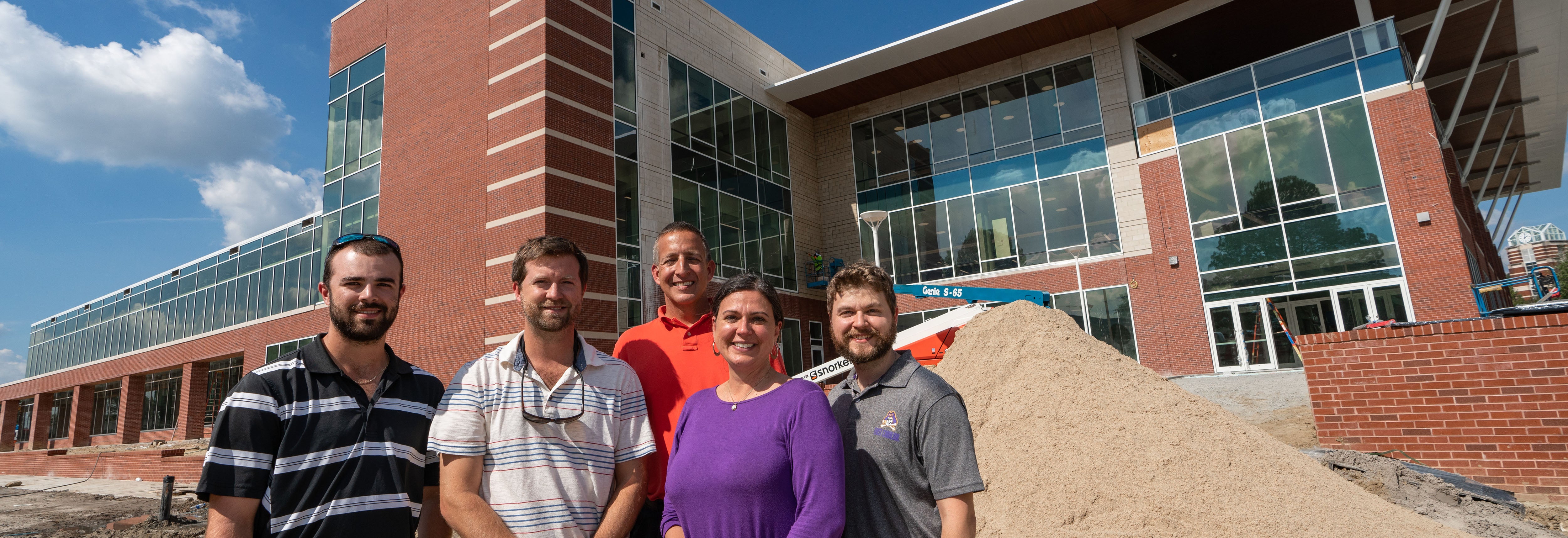 Justin Spears (left), Scott Andrews, Tom Daniel, Jenny Sutton and Chris Denton in front of the new Main Campus Student Center.