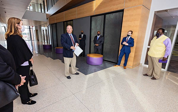 ECU Assistant Project Managers Director Robert Brown gives a tour of the building to ECU Board of Trustees members and staff.