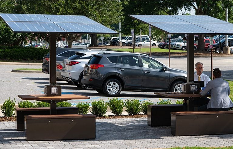A pair of solar tables with lights and charging stations was installed last summer outside the Brody School of Medicine.