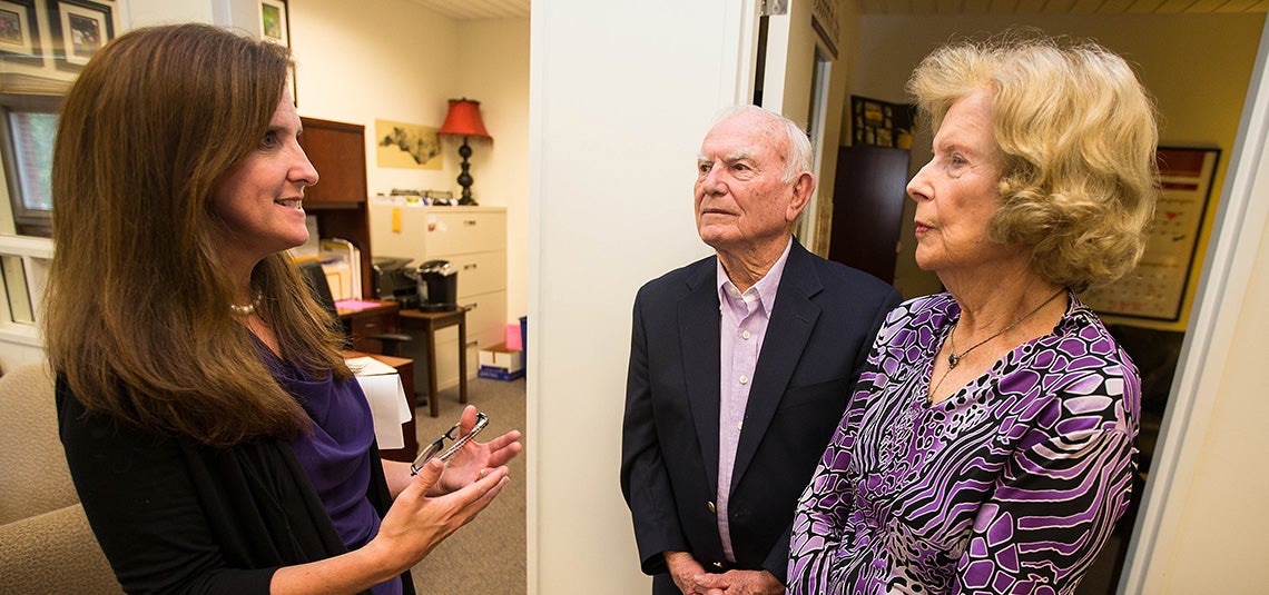Walter and Marie Williams, center and right, speak with ECU's STEPP program director Sarah Williams during an event in 2014 recognizing the couple's sizable donation to the program. The program was renamed the Walter and Marie Williams STEPP program in their honor.