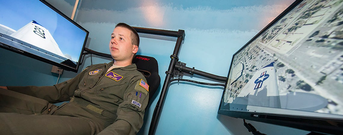 A student sits in the ECU Air Force ROTC flight simulator in Wright Annex.