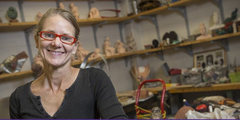 Chris Morgan, an ECU art graduate student, is shown in her studio space in the Jenkins Fine Arts Center. Morgan is involved in effort to make simple hand-sewn shoes for the children to improve their physical and economic condition by creating a cottage industry in the area.