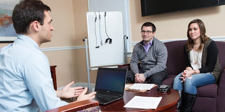 ECU doctoral student Dan Blocker and graduate student Meagan Collins are working with Drs. Jake Jensen, foreground, and Matt Fish, not pictured, on a study to determine how confiding in friends about relationship problems is linked to the overall quality of the relationship. (Photos by Cliff Hollis)