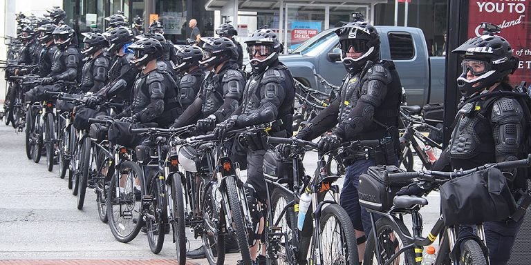 Police block a Cleveland street to prevent a protest march from deviating from the approved route. (Contributed photos)