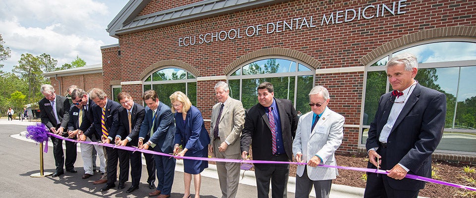 Dr. Greg Chadwick, dean of School of Dental Medicine; Dr. Michael Scholtz, director of ECU community dental practices; Frank Williams, Brunswick County commissioner; Randy Thompson, Brunswick County commissioner; David Redwine, former ECU trustee; Mark Tipton, former ECU trustee; Chance Lambeth, deputy district director for U.S. Rep. David Rouzer; Dr. Phyllis Horns, vice chancellor for health sciences; Chancellor Steve Ballard; David Stanley, executive director of Brunswick County Health and Human Services; N.C. Rep. Frank Iler; Jeff Earp, president of Brunswick Forest. (Photos by Cliff Hollis)