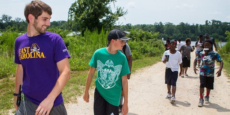 Nutrition Science student and camp counselor Jared Lowe leads a group of campers during a mile-long hike as part of the Love A Sea Turtle program’s education efforts. (Photos by Cliff Hollis)