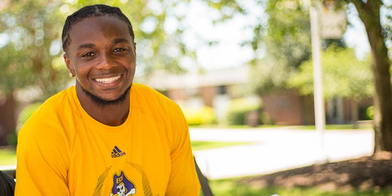 East Carolina University football player Jeffrey Coprich honors his sister’s memory through the Essence K. Coprich library and book club. (Photos by Cliff Hollis)