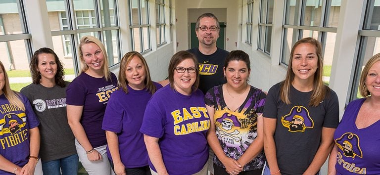 ECU College of Education alumni traveled to the Dominican Republic to work with the people of La Romana. Pictured left to right: Joelle Trongone ’09, Stephanie Powers ’08, Hilary Patty ’11, Michelle Kessler ’00, Michelle Money ’96, Megan Neal ’09, Jami Dickerson ’09, Cathy Kirkland ’90 ’04; Rear: Andrew Kievit ’96; Not pictured: Toni Sheriff ’11, Nicole Hitchens ’11 ’16. (Photo by Cliff Hollis)