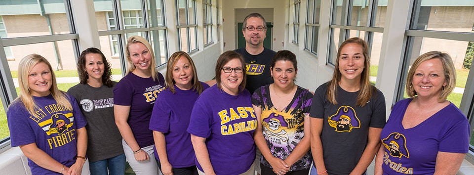 ECU College of Education alumni traveled to the Dominican Republic to work with the people of La Romana. Pictured left to right: Joelle Trongone ’09, Stephanie Powers ’08, Hilary Patty ’11, Michelle Kessler ’00, Michelle Money ’96, Megan Neal ’09, Jami Dickerson ’09, Cathy Kirkland ’90 ’04; Rear: Andrew Kievit ’96; Not pictured: Toni Sheriff ’11, Nicole Hitchens ’11 ’16. (Photo by Cliff Hollis)