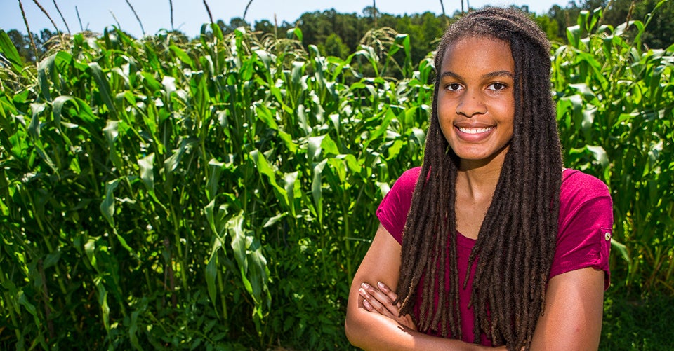 Jonelle Romero volunteers at the Making Pitt Fit Community Garden in Greenville. Through the Access Scholarship, she’s gained volunteer experience that has helped her learn more about the correlation between working with plants and dentistry. (Photos by Cliff Hollis)