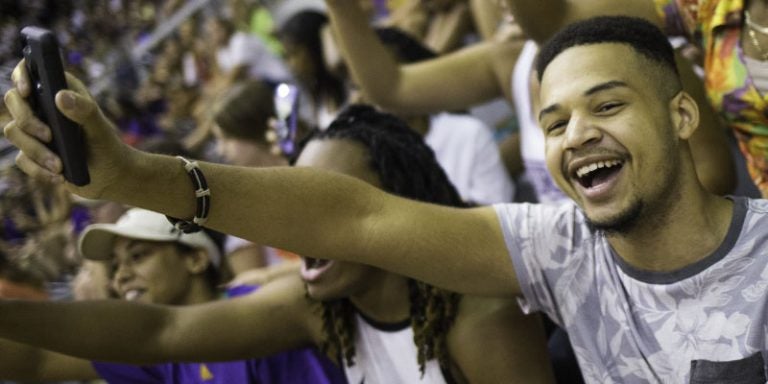 ECU freshman Michael Holland and friends enjoy a pep rally during the 16th annual Student Welcome and Convocation at Minges Coliseum Aug. 21. (Photos by Cliff Hollis)