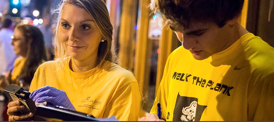 ECU students Macie Whitlow and Garrett VanHoy are among a group of student researchers assisting health and human performance professor Beth Chaney in her research on alcohol consumption and hazardous drinking behaviors. (Photos by Cliff Hollis)