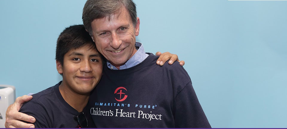 Chuck Barber, right, enjoys a moment with Luis Amarro, who had heart surgery in Greenville thanks to the Children's Heart Project. Barber and his wife were pre-surgery hosts for the Bolivian families. (Photos by Cliff Hollis)