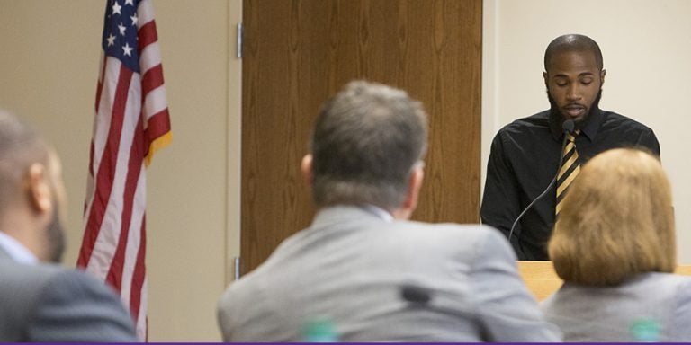 Tyree Barnes, an ECU senior from Weldon, presented student concerns about the name of Aycock Hall during the Nov. 21 Board of Trustees meeting on campus. A number of students attended the meeting and supported Barnes by standing throughout his presentation. (Photos by Jay Clark)