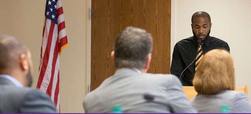 Tyree Barnes, an ECU senior from Weldon, presented student concerns about the name of Aycock Hall during the Nov. 21 Board of Trustees meeting on campus. A number of students attended the meeting and supported Barnes by standing throughout his presentation. (Photos by Jay Clark)