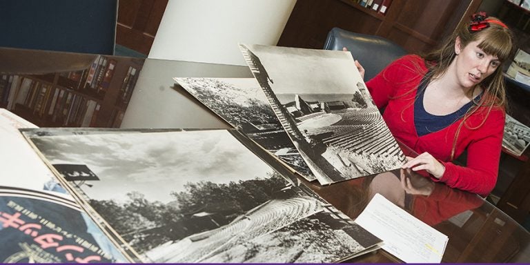 Ashley Williams, project librarian at ECU's Joyner Library, displays some of the materials being catalogued from hundreds of outdoor theaters for an online inventory. (Photos by Cliff Hollis)