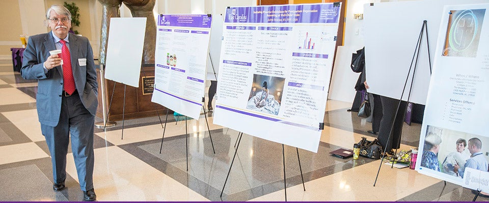 Dr. L. Allen Dobson, keynote speaker and current president and CEO of Community Care of North Carolina, was the keynote speaker at the 11th annual Jean Mills Health Symposium held Feb. 6 at East Carolina University.