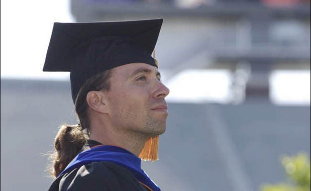 ECU communication professor John Howard accepted the 2011 Board of Governors' Award for Excellence in Teaching during the annual fall commencement, May 6. (Photo by Cliff Hollis)