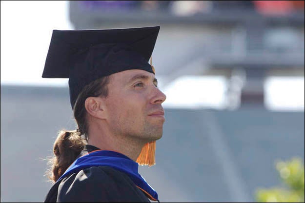 ECU communication professor John Howard accepted the 2011 Board of Governors' Award for Excellence in Teaching during the annual fall commencement, May 6. (Photo by Cliff Hollis)